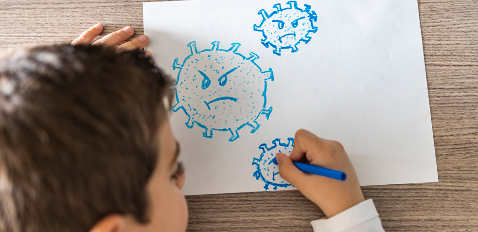 niño dibujando corona virus azules