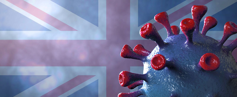 Ilustración del coronavirus con el fondo de la bandera de 
Reino Unido 